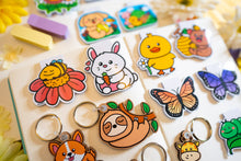 Load image into Gallery viewer, The Sleepy Bee Bamboo Sticker is an eco-friendly accessory featuring an adorable illustration of a drowsy bee. Crafted from 100% sustainable bamboo, this sticker measures approximately 3x3 inches. It is designed to be fade and weather-resistant, making it suitable for various surfaces such as hydro flasks, journals, and tote bags. The strong 3M water-resistant adhesive ensures durability and longevity. Due to the natural variations in bamboo, each sticker may have slight differences in color and appearance.