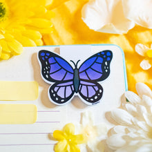 Load image into Gallery viewer, A delicate magnetic bookmark featuring a beautifully detailed purple butterfly with elegant, fluttering wings. This eco-friendly bookmark has a soft, hand-drawn style, perfect for adding a touch of nature’s beauty to your reading! 🦋📖✨