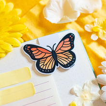 Load image into Gallery viewer, A delicate magnetic bookmark featuring a beautifully detailed purple butterfly with elegant, fluttering wings. This eco-friendly bookmark has a soft, hand-drawn style, perfect for adding a touch of nature’s beauty to your reading! 🦋📖✨