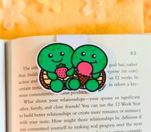 Load image into Gallery viewer, A set of 6 adorable magnetic bookmarks featuring different animals enjoying snack time, including a bear with honey, a cat with fish, and more. These eco-friendly bookmarks have a playful, hand-drawn style, perfect for adding a fun and colorful touch to your reading! 🐻🐱🍪📖✨