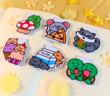 Load image into Gallery viewer, A set of 6 adorable magnetic bookmarks featuring different animals enjoying snack time, including a bear with honey, a cat with fish, and more. These eco-friendly bookmarks have a playful, hand-drawn style, perfect for adding a fun and colorful touch to your reading! 🐻🐱🍪📖✨