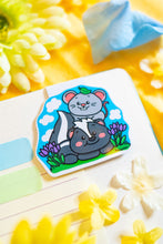Load image into Gallery viewer, A cute magnetic bookmark featuring an adorable skunk and a tiny mouse sharing a sweet moment. This eco-friendly bookmark has a charming, hand-drawn style, perfect for marking your favorite pages with a touch of woodland whimsy! 🦨🐭📖✨