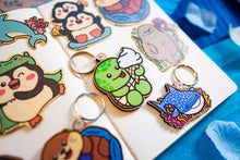 Load image into Gallery viewer, A keychain combining a turtle and ice cream design, crafted from cherry veneer wood, available at Belugabe