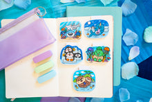 Load image into Gallery viewer, A vibrant magnetic bookmark featuring a group of sharks swimming gracefully through a colorful coral reef. This eco-friendly bookmark has a stunning, hand-drawn design, perfect for adding an oceanic touch to your reading! 🦈🌊🐠📖✨