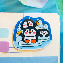 Load image into Gallery viewer, A cute magnetic bookmark featuring a penguin standing on an iceberg, surrounded by cool, icy details. This eco-friendly bookmark has a charming, hand-drawn style, perfect for adding a chilly touch to your reading! 🐧❄️📖✨