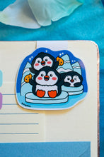 Load image into Gallery viewer, A cute magnetic bookmark featuring a penguin standing on an iceberg, surrounded by cool, icy details. This eco-friendly bookmark has a charming, hand-drawn style, perfect for adding a chilly touch to your reading! 🐧❄️📖✨