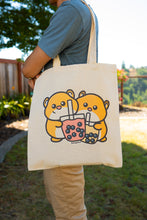 Load image into Gallery viewer, Belugabee Hamster Boba Tote Bag Alt Text: A whimsical tote featuring adorable hamsters enjoying boba drinks. Crafted with care on eco-friendly material, this bag blends cuteness with environmental consciousness. 🐹🥤👜 #BobaTote #CuteEcoFashion #HamsterDesign