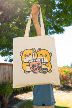 Load image into Gallery viewer, Belugabee Hamster Boba Tote Bag Alt Text: A whimsical tote featuring adorable hamsters enjoying boba drinks. Crafted with care on eco-friendly material, this bag blends cuteness with environmental consciousness. 🐹🥤👜 #BobaTote #CuteEcoFashion #HamsterDesign