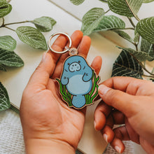 Load image into Gallery viewer, Manatee Wooden Keychain - A charming solo manatee keychain, featuring a vibrant underwater design. 🌊🦭 #ManateeKeychain #OceanCharm #WoodenAccessories