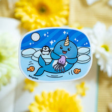 Load image into Gallery viewer, A whimsical glossy sticker featuring a cheerful narwhal swimming through the ocean with its signature spiral tusk. This eco-friendly sticker has a fun, hand-drawn style, perfect for adding a touch of ocean magic to your laptop, water bottle, or notebook! 🦄🌊✨