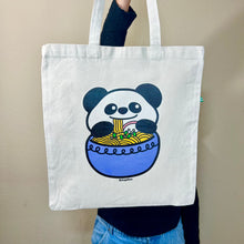 Load image into Gallery viewer, The Panda Ramen Tote Bag is a charming accessory that combines the cuteness of pandas with the allure of ramen. Crafted from eco-friendly materials, this tote is both functional and stylish