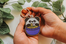 Load image into Gallery viewer, The Panda Ramen Tote Bag is a delightful accessory that combines the charm of pandas with the allure of ramen. Crafted from eco-friendly materials, this tote is both functional and stylish