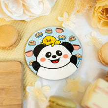 Load image into Gallery viewer, Panda and Duckie Cozy Cafe Coaster showcasing an adorable panda and duck duo enjoying coffee mugs, surrounded by cinnamon sticks and a delightful cupcake, perfect for a charming and cozy vibe.