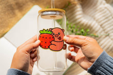 Load image into Gallery viewer, A cute pig happily hugging a big, juicy strawberry, with a soft pastel background. This eco-friendly bamboo sticker has an adorable, hand-drawn style, perfect for decorating laptops, water bottles, and notebooks. 🍓🐷💖
