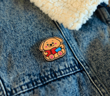 Load image into Gallery viewer, A charming wooden pin featuring a cute puppy with glasses, deeply focused on reading a book. This eco-friendly pin has a delightful, hand-carved design, perfect for adding a touch of puppy love to your accessories! 🐶📖✨