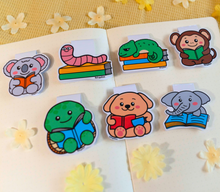 Load image into Gallery viewer, A set of adorable bookmarks featuring different animals and scenes, each with a playful "Reading Time" design. These eco-friendly bookmarks have a charming, hand-drawn style, perfect for marking your place with a fun, bookish touch! 📚✨🐾
