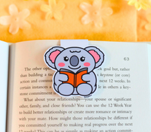 Load image into Gallery viewer, A set of adorable bookmarks featuring different animals and scenes, each with a playful "Reading Time" design. These eco-friendly bookmarks have a charming, hand-drawn style, perfect for marking your place with a fun, bookish touch! 📚✨🐾