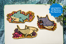 Load image into Gallery viewer, A fintastic set of three eco-friendly bamboo stickers featuring adorable sharks in playful and dynamic poses! Perfect for decorating water bottles, laptops, notebooks, and more. A must-have for shark lovers and ocean enthusiasts!