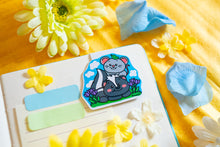 Load image into Gallery viewer, The Special Spring Magnetic Bookmark Set is a collection of five charming bookmarks, each featuring unique spring-themed designs. These bookmarks are double-sided, with a protective laminate on the front that provides a glossy finish. Each bookmark measures approximately 2.4 inches on its longest side and contains a strong rectangular magnet inside to securely hold your page without causing damage. Please note that colors may vary slightly from the pictures due to lighting and other factors. This set includ