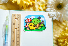 Load image into Gallery viewer, A glossy sticker featuring a cute turtle lounging with a relaxed expression. The turtle has a smooth, rounded shell and a peaceful vibe, giving off a chill and carefree energy.
Let me know if you want any changes! 😊🐢✨