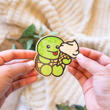 Load image into Gallery viewer, An eco-friendly bamboo sticker featuring a turtle with a strawberry-patterned shell.
