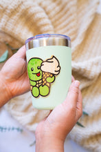 Load image into Gallery viewer, An eco-friendly bamboo sticker featuring a turtle with a strawberry-patterned shell.
