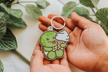 Load image into Gallery viewer, A keychain combining a turtle and ice cream design, crafted from cherry veneer wood, available at Belugabe