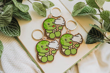 Load image into Gallery viewer, A keychain combining a turtle and ice cream design, crafted from cherry veneer wood, available at Belugabe