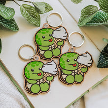 Load image into Gallery viewer, A keychain combining a turtle and ice cream design, crafted from cherry veneer wood, available at Belugabe
