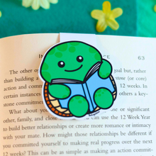 Load image into Gallery viewer, A magnetic bookmark featuring a turtle design, printed on high gloss cardstock, available on the company's website