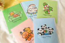 Load image into Gallery viewer, A set of festive holiday cards featuring adorable pandas, frogs, and reindeers. Each card is decorated with playful illustrations of the animals, wearing holiday-themed accessories like scarves and hats, and all cards include the message "Happy Holiday" in cheerful lettering