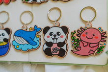 Load image into Gallery viewer, Belugabee Wooden Keychain Collection: A visually stunning arrangement featuring ten unique designs, including pandas, cows, turtles, and more. Elevate your accessories with this eco-friendly ensemble. 🐼🐮🐢🔑 #WoodenKeychain #AnimalDesigns #EcoFriendlyAccessories