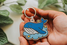 Load image into Gallery viewer, Belugabee Dreamy Whale Wooden Keychain: Solo keychain crafted from responsibly sourced cherry veneer wood, featuring a dreamy whale in vibrant colors. Elevate your style with this eco-friendly 2.5-inch accessory. 🐋🔑 #DreamyWhaleKeychain #WoodenAccessories #SoloKeychain