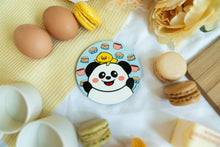 Load image into Gallery viewer, Panda and Duckie Cozy Cafe Coaster showcasing an adorable panda and duck duo enjoying coffee mugs, surrounded by cinnamon sticks and a delightful cupcake, perfect for a charming and cozy vibe.