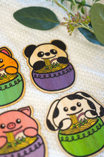 Load image into Gallery viewer, "Belugabee Bamboo Stickers: Playful scene featuring a Dalmatian dog slurping noodles from a green bowl, positioned below a charming panda slurping from a purple bowl of ramen. Elevate your style with these adorable 3x3-inch eco-friendly stickers. 🐾🐼🍜 #BambooStickers #DalmatianDogRamen #PandaRamen #NoodleLovers