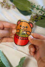 Load image into Gallery viewer, Bamboo Sticker Bear and Ramen bending sideways to show bamboo flexibility and durability