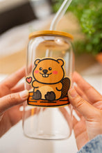 Load image into Gallery viewer, Bamboo Sticker Beaver on a Glass Cup, Bamboo wood sticker of beaver placed on a cup to show the adhesive