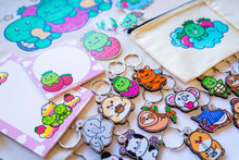 Load image into Gallery viewer, Unboxing a Belugabee Grade A Mystery Bag: Excitement as hands unwrap cute surprises, including tote bags, pencil pouches, memo pads, bamboo stickers, sticker sheets, die-cut stickers, and pins. A joyous discovery awaits! 🎁🛍️ #MysteryBagUnboxing #SurpriseGifts #CuteSurprises