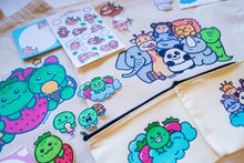 Load image into Gallery viewer, Unboxing a Belugabee Grade A Mystery Bag: Excitement as hands unwrap cute surprises, including tote bags, pencil pouches, memo pads, bamboo stickers, sticker sheets, die-cut stickers, and pins. A joyous discovery awaits! 🎁🛍️ #MysteryBagUnboxing #SurpriseGifts #CuteSurprises