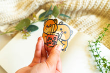 Load image into Gallery viewer, Belugabee Bamboo Sticker: Adorable duo of hamsters holding boba cups, crafted on eco-friendly bamboo, showcasing flexibility when bent. Elevate your style with this charming 3x3-inch sticker. 🐹🥤🌿 #BambooSticker #HamsterBobaDesign #CuteDecor