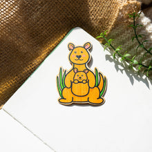 Load image into Gallery viewer, A heartwarming bamboo sticker featuring a kangaroo mother and her baby, adding a touch of wildlife love to your belongings. 🦘💚 #KangarooSticker #BambooArt #WildlifeCharm