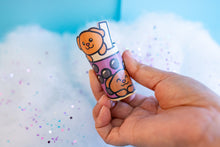 Load image into Gallery viewer, An adorable group of puppies playfully peeking out of a boba tea cup, with tapioca pearls at the bottom. This eco-friendly bamboo sticker features a cute, hand-drawn style, perfect for decorating laptops, water bottles, and notebooks! 🐶🧋✨
