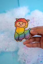 Load image into Gallery viewer, A fluffy alpaca llama with a soft rainbow-colored coat, standing happily with a cheerful expression. This eco-friendly bamboo sticker features a cute, hand-drawn style, perfect for adding a colorful touch to laptops, water bottles, and journals! 🌈🦙✨