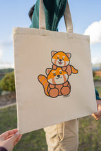 Load image into Gallery viewer, A heartwarming design featuring a loving red panda mom cuddling her adorable baby, surrounded by soft nature-inspired details. Printed on a sturdy, eco-friendly tote bag, perfect for carrying books, groceries, and everyday essentials. A must-have for red panda lovers!