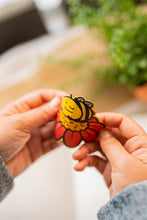 Load image into Gallery viewer, A cozy, sleepy bee curled up with tiny "Zzz" floating above, resting on a fluffy flower. This eco-friendly bamboo sticker has a soft, hand-drawn style, perfect for adding a touch of charm to laptops, water bottles, and journals