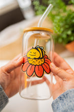 Load image into Gallery viewer, A cozy, sleepy bee curled up with tiny "Zzz" floating above, resting on a fluffy flower. This eco-friendly bamboo sticker has a soft, hand-drawn style, perfect for adding a touch of charm to laptops, water bottles, and journals