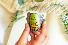 Load image into Gallery viewer, This set includes a green turtle cartoon character with a red tongue sticking out, holding a waffle cone ice cream with a white swirl on top. The adhesive is very strong, so make sure you stick this sticker onto a place where you'd want it for a long time