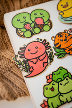 Load image into Gallery viewer, A cute turtle with a happy expression, carrying a delicious dessert on its shell! This eco-friendly bamboo sticker features vibrant colors and charming details, perfect for decorating water bottles, laptops, and notebooks. A sweet treat for turtle lovers and dessert enthusiasts alike!
