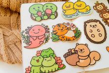 Load image into Gallery viewer, A cute turtle with a happy expression, carrying a delicious dessert on its shell! This eco-friendly bamboo sticker features vibrant colors and charming details, perfect for decorating water bottles, laptops, and notebooks. A sweet treat for turtle lovers and dessert enthusiasts alike!