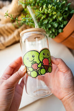 Load image into Gallery viewer, A cute turtle with a happy expression, carrying a delicious dessert on its shell! This eco-friendly bamboo sticker features vibrant colors and charming details, perfect for decorating water bottles, laptops, and notebooks. A sweet treat for turtle lovers and dessert enthusiasts alike!